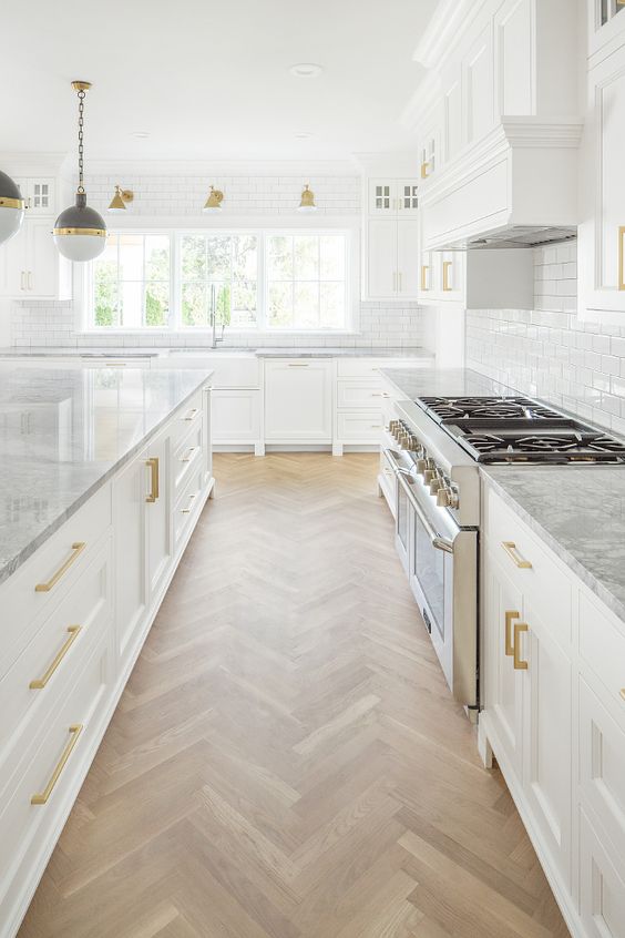 White Kitchen Designs You Haven't Seen Yet! Beautiful white kitchen inspiration for your remodel. Marble Countertop, wood bar stools, island light, island, bright white #whitekitchen #modern