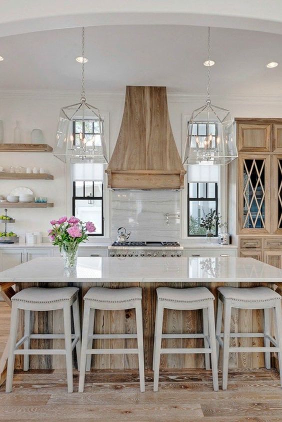 White Kitchen Designs You Haven't Seen Yet! Beautiful white kitchen inspiration for your remodel. Marble Countertop, wood bar stools, island light, island, bright white #whitekitchen #farmhouse