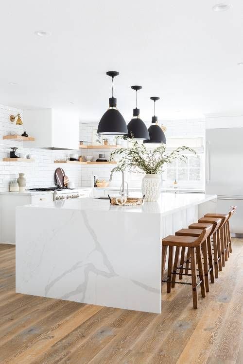 15 White Kitchen Designs You Haven't Seen Yet! Beautiful white kitchen inspiration for your remodel. Marble Countertop, black pendant light, island, bright white #whitekitchen #modern 