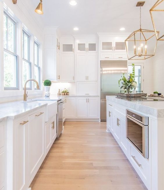 White Kitchen Designs You Haven't Seen Yet! Beautiful white kitchen inspiration for your remodel. Marble Countertop, black pendant light, island, bright white #whitekitchen #modern