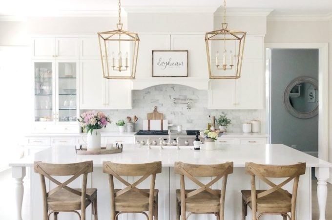 White Kitchen Designs You Haven't Seen Yet! Beautiful white kitchen inspiration for your remodel. Marble Countertop, black pendant light, island, bright white #whitekitchen #modern