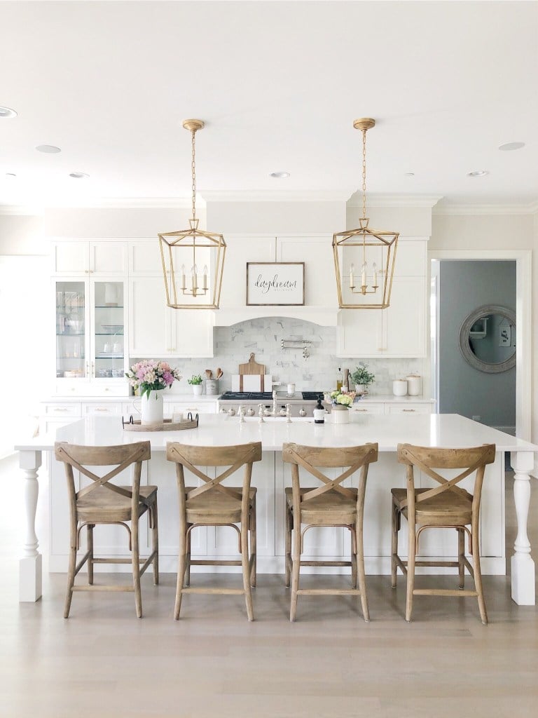 White Kitchen Designs You Haven't Seen Yet! Beautiful white kitchen inspiration for your remodel. Marble Countertop, black pendant light, island, bright white #whitekitchen #modern