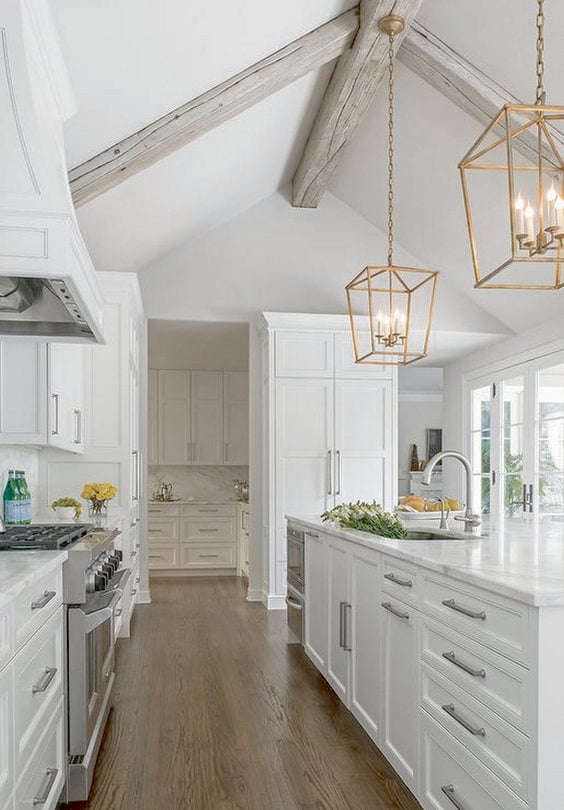 White Kitchen Designs You Haven't Seen Yet! Beautiful white kitchen inspiration for your remodel. Marble Countertop, black pendant light, island, bright white #whitekitchen #modern