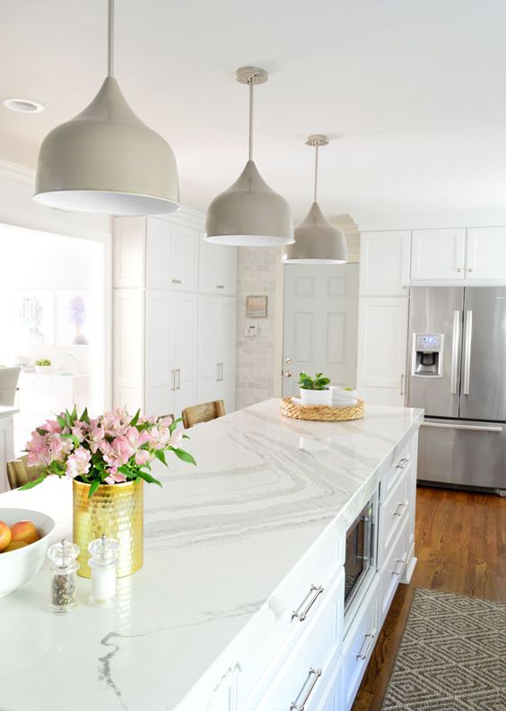 White Kitchen Designs You Haven't Seen Yet! Beautiful white kitchen inspiration for your remodel. Marble Countertop, black pendant light, island, bright white #whitekitchen #modern