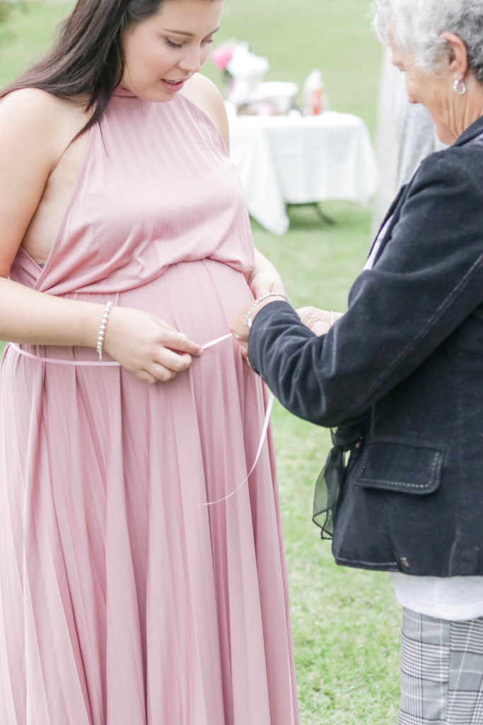 One fun baby shower game was measuring my belly as the guests guessed how big Baby Kusters was!