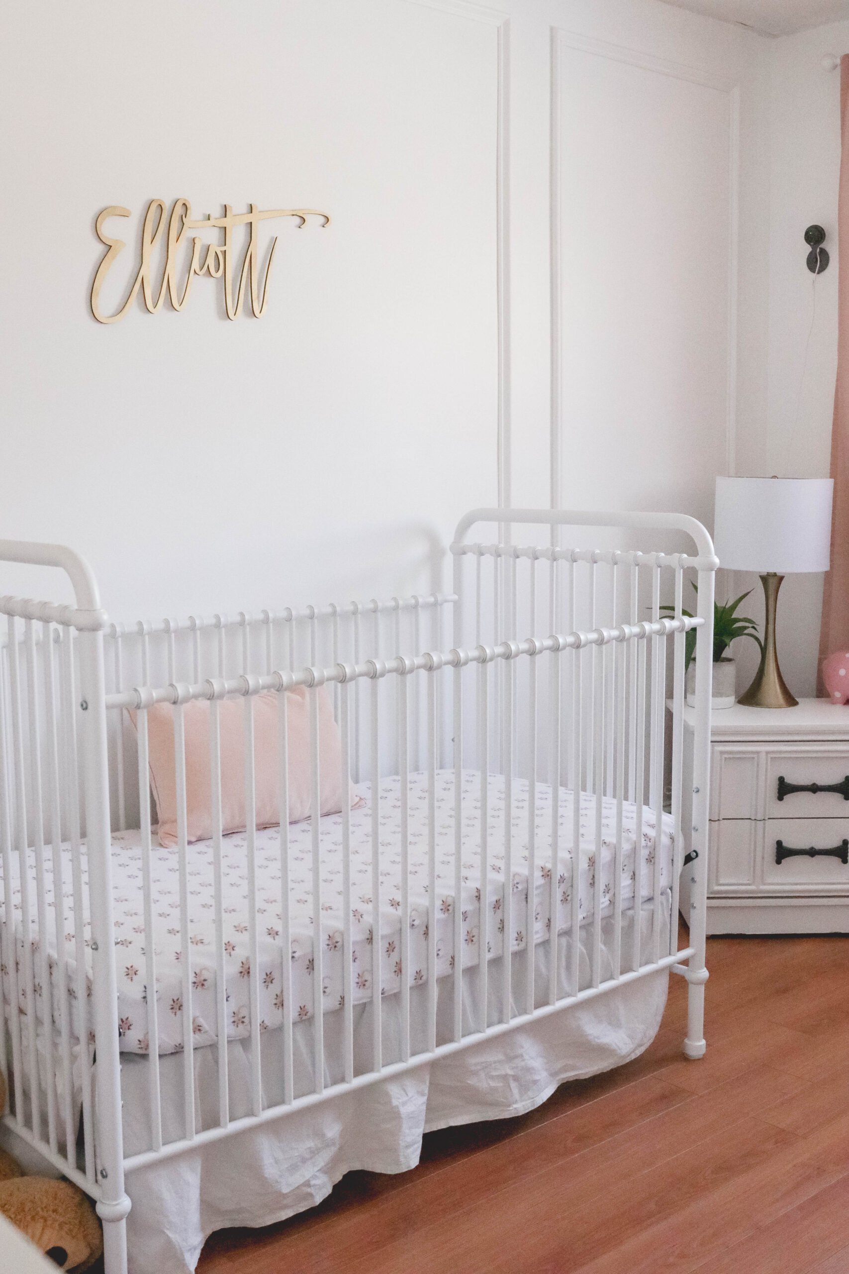 Baby Girl White and Pink Nursery Reveal; White vintage crib, name sign on wall, wainscotting