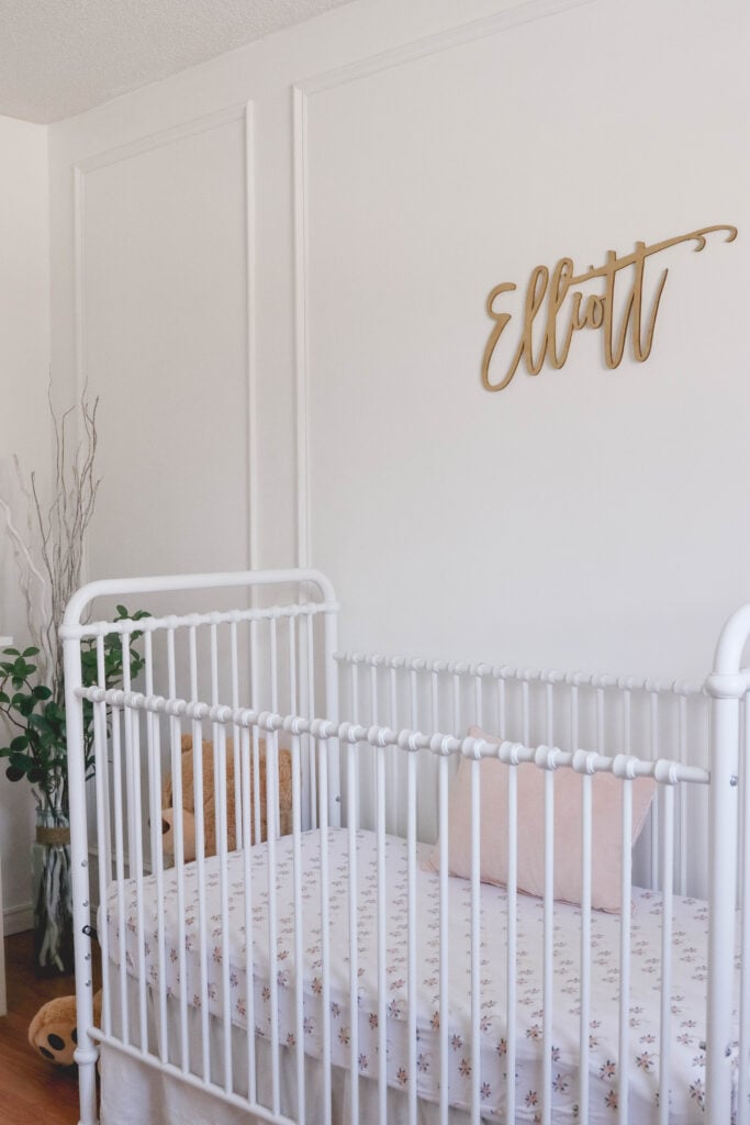 Baby Girl White and Pink Nursery Reveal; White vintage crib, name sign on wall, wainscotting