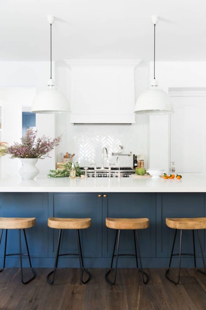 11 Best Kitchens by Studio McGee; The bold, dark navy cabinets in this kitchen were a great choice to pair with the stark white walls and counter tops