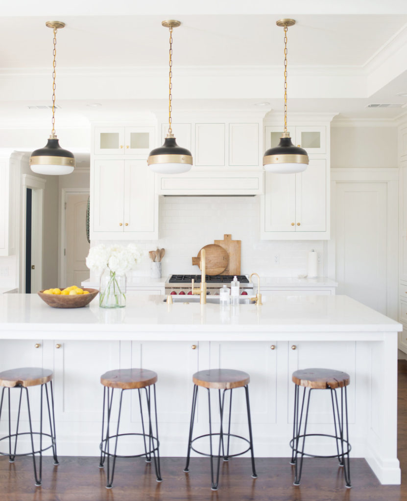 11 Best Kitchens by Studio McGee; This all-white farmhouse style kitchen has so much open, inviting space for family and guests