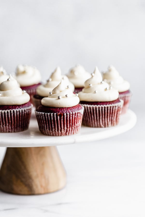 Vegan red velvet cupcakes are the ultimate healthy dessert! Sweet cream cheese frosting tops moist, chocolatey red velvet cupcakes.