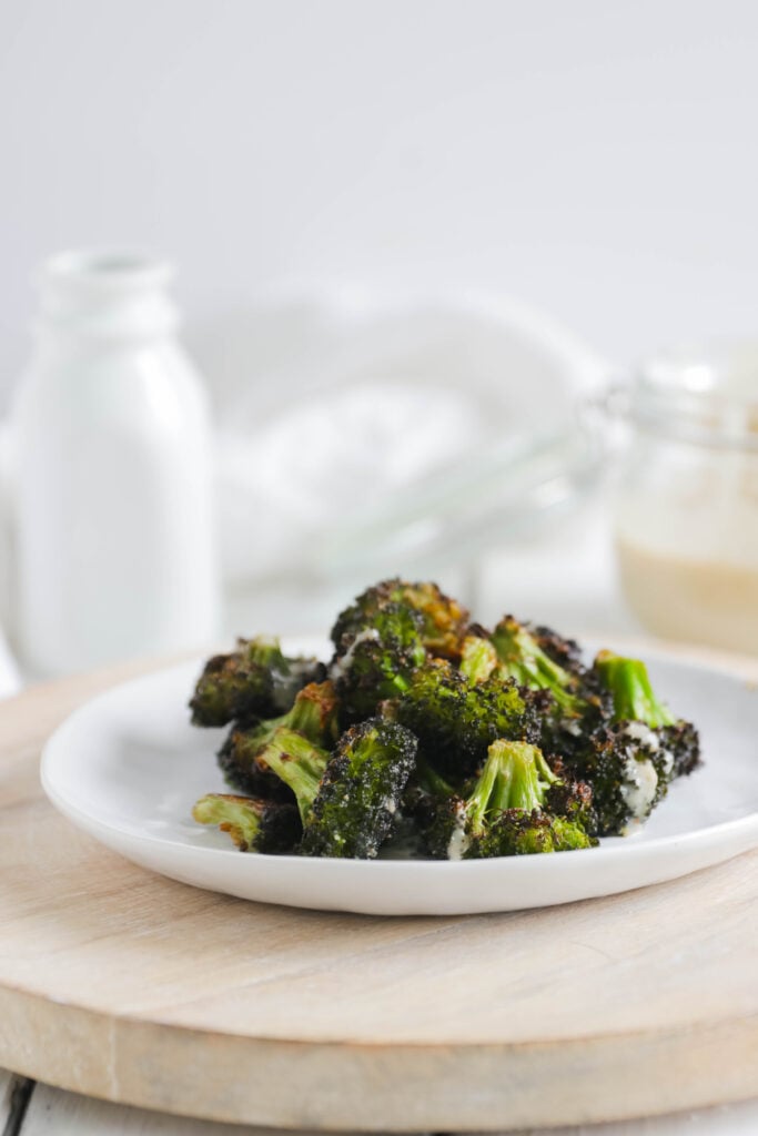 Crispy Broccoli with Vegan Cheese Sauce; dairy and gluten free side dish for your vegan dinner! A nut free cheese sauce that you will love smothered on your blackened broccoli!