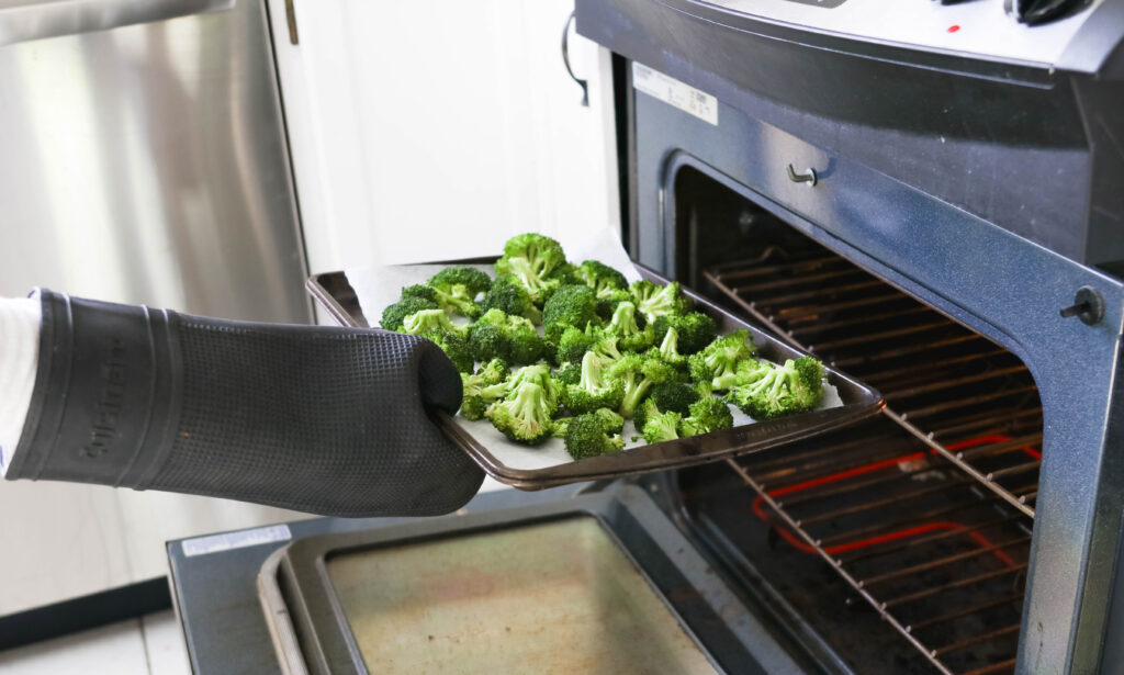 Into the oven Crispy Broccoli with Vegan Cheese Sauce; dairy and gluten free side dish for your vegan dinner! A nut free cheese sauce that you will love smothered on your blackened broccoli!