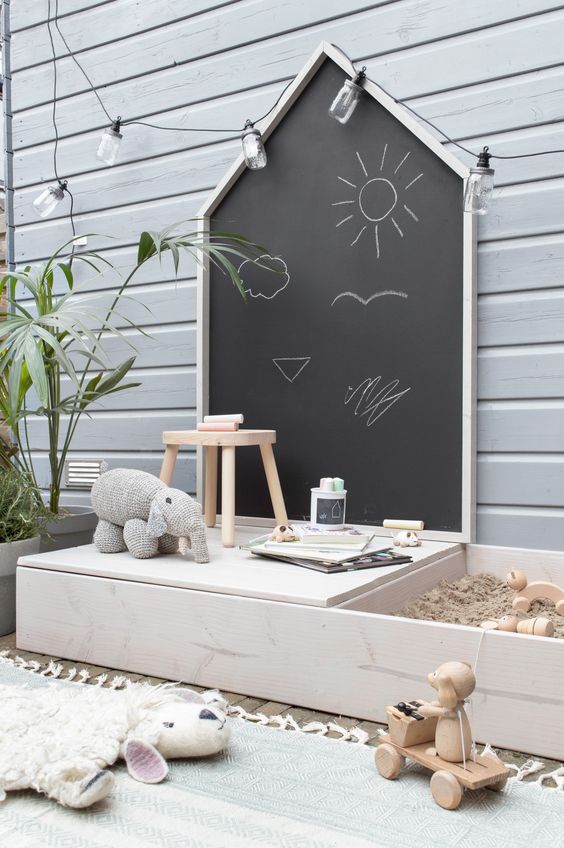 15 Deck Must Haves for Summer Entertaining; kids play area on deck, chalkboard, sand pit