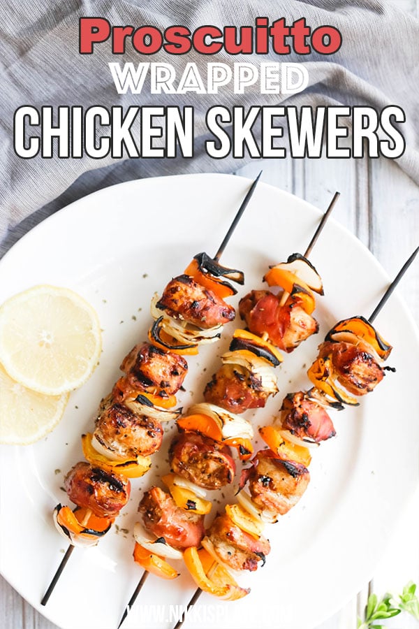 This Prosciutto Wrapped Chicken Skewers recipe is a quick and easy BBQ dinner that is bursting with salty goodness and juice peppers and onions. || Nikki's Plate
