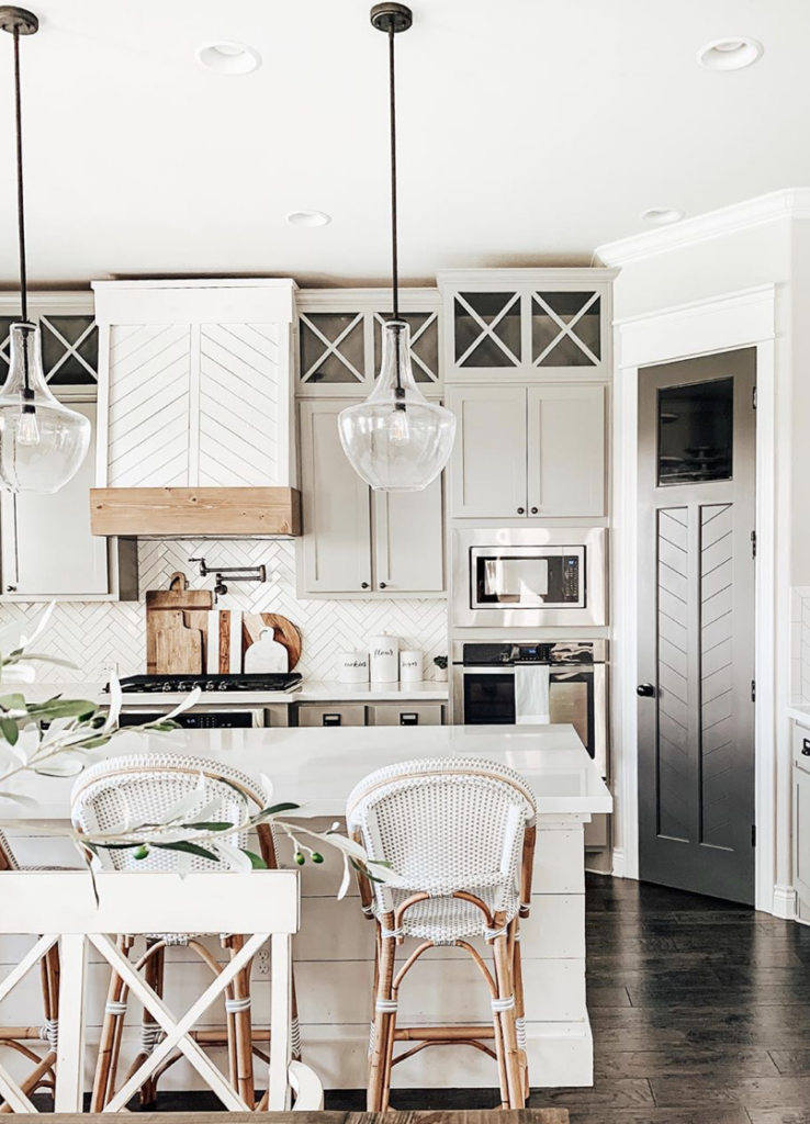 Best Home Decor Instagram Accounts You Should Be Following; White kitchen, clear pendents, farmhouse