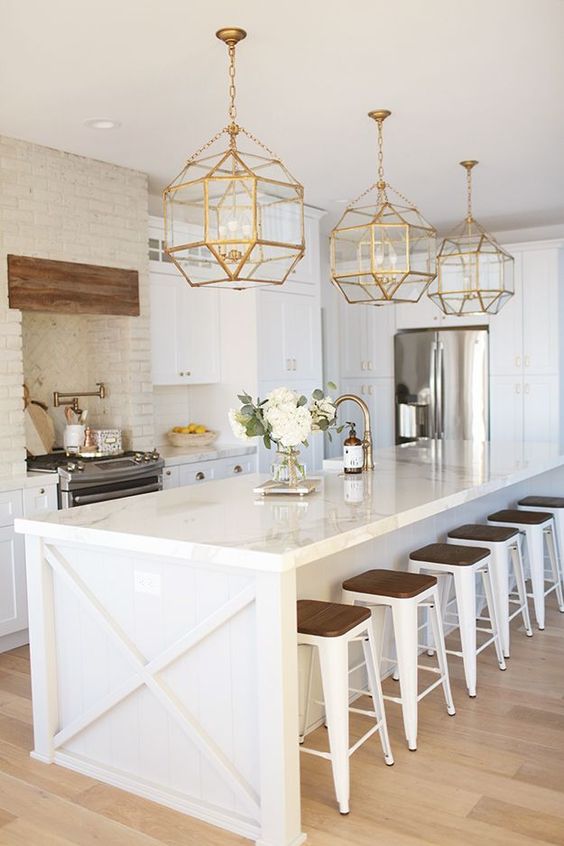 Best Home Decor Instagram Accounts You Should Be Following; White kitchen, gold pendents