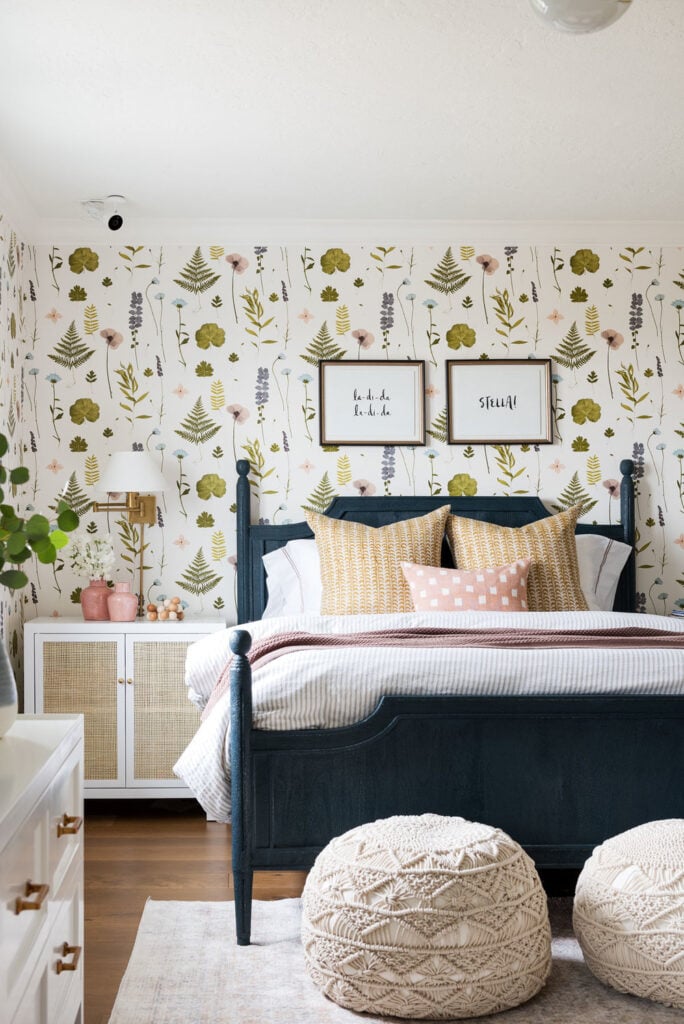 Studio McGee by Bedrooms: Northridge Remodel; Floral wall paper, dark blue bed, antique bedroom