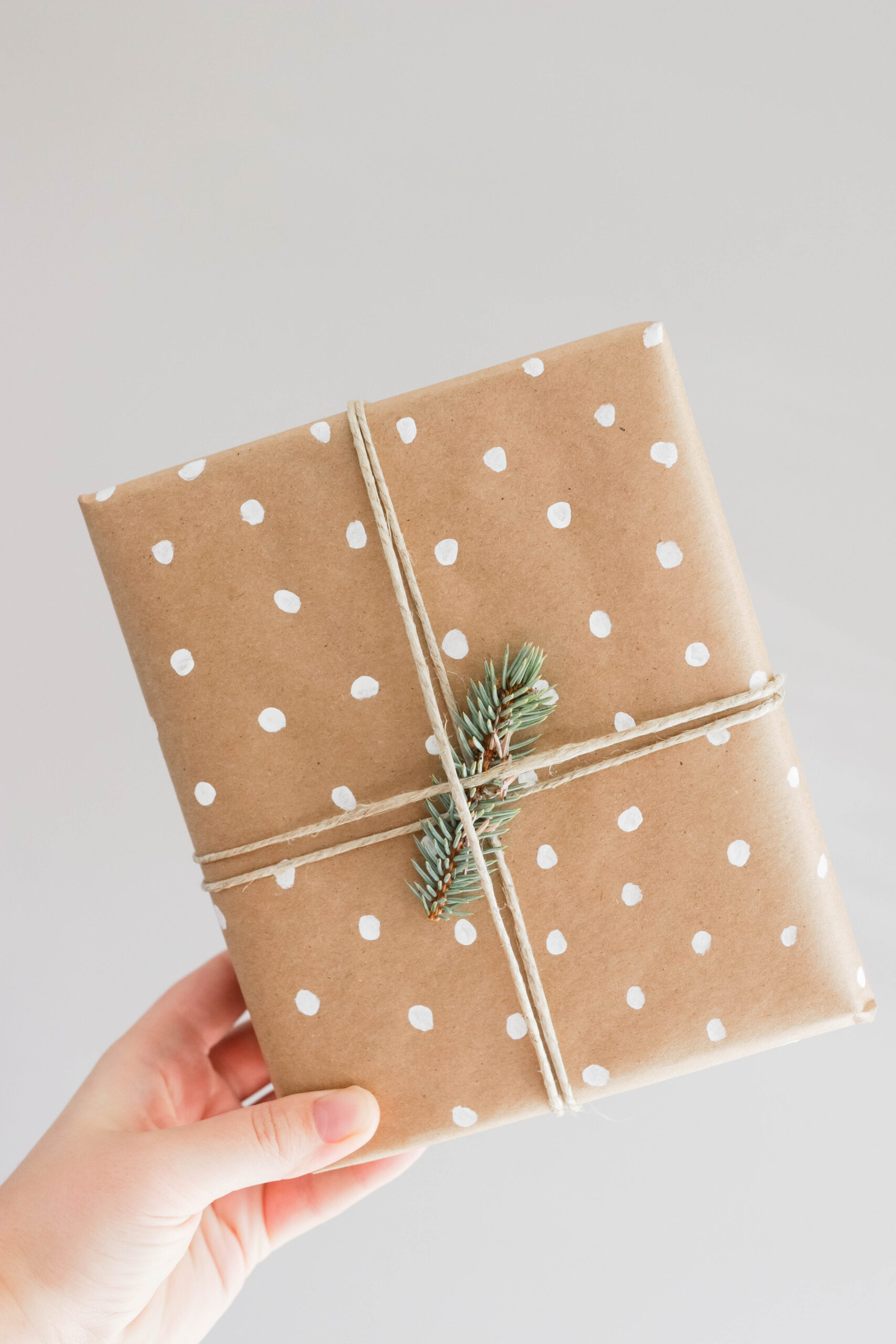 Easy Rustic DIY Christmas Wrapping; Here are three present ideas for you to get creative with for your rustic Xmas gifting! White Dots with greenery and twine || Nikki's Plate #rusticgiftwrapping