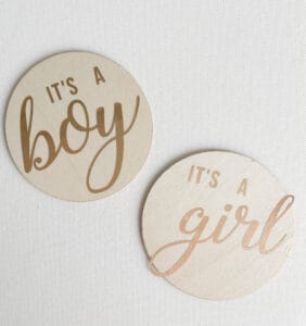 DIY Wooden Birth Announcement Signs; Wood discs with "It's A Boy" and "It's A Girl". Made with Cricut machine but can be made without!