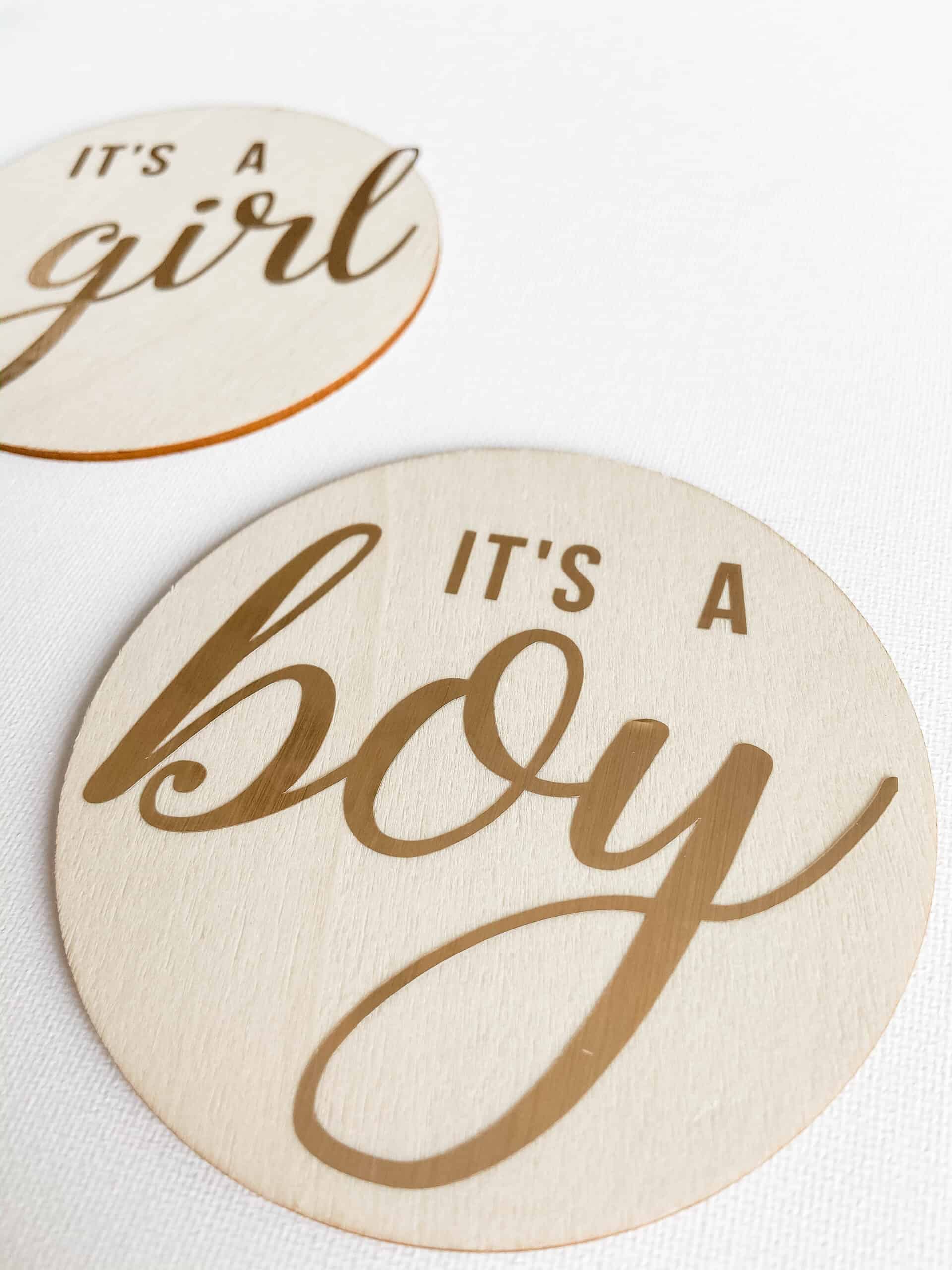 DIY Wooden Birth Announcement Signs; Wood discs with "It's A Boy" and "It's A Girl". Made with Cricut machine but can be made without!