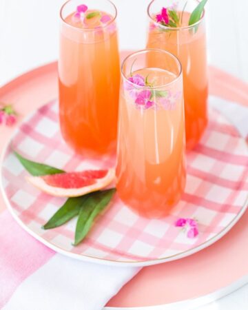 Delicious Summer Cocktail: Citrus Champagne Punch - made with orange and grapefruit juices, simple syrup, and grenadine.