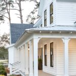 white modern farm house, black trim windows, large front porch