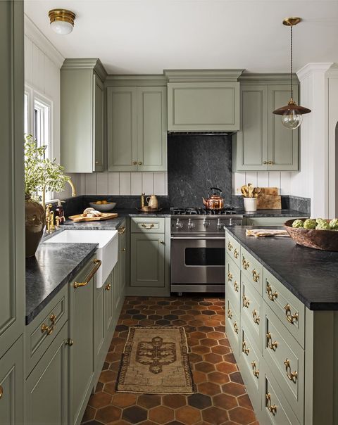 green kitchen, black countertops - 15 Beautiful Kitchens with Soapstone Countertops; Elegant and durable, soapstone is a favourite material for kitchen countertops. See 15 beautiful kitchens with soapstone countertops here.
