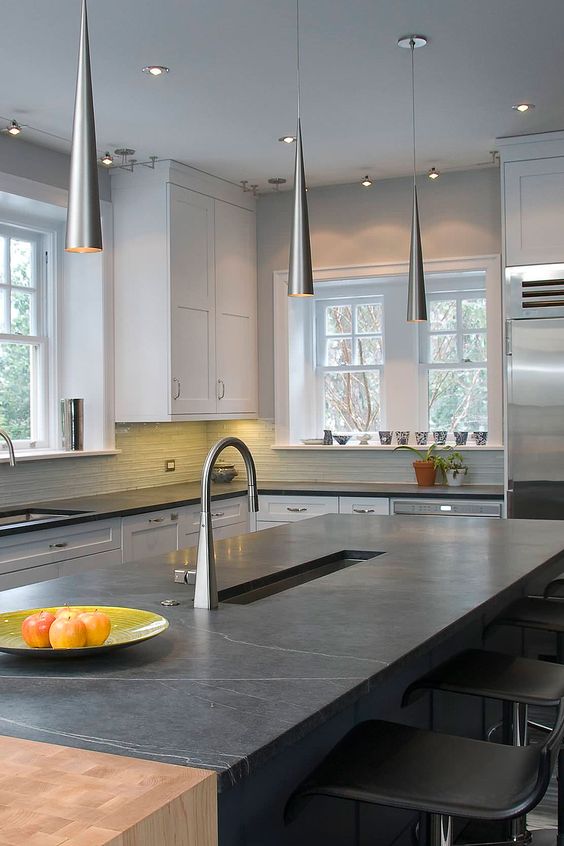 black countertops- 15 Beautiful Kitchens with Soapstone Countertops; Elegant and durable, soapstone is a favourite material for kitchen countertops. See 15 beautiful kitchens with soapstone countertops here.