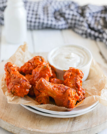 Garlic Buffalo Chicken Wings - These buffalo chicken wings pack quite a bit of garlic punch. They're spicy, but if you're a garlic lover, this easy appetizer recipe is for you.