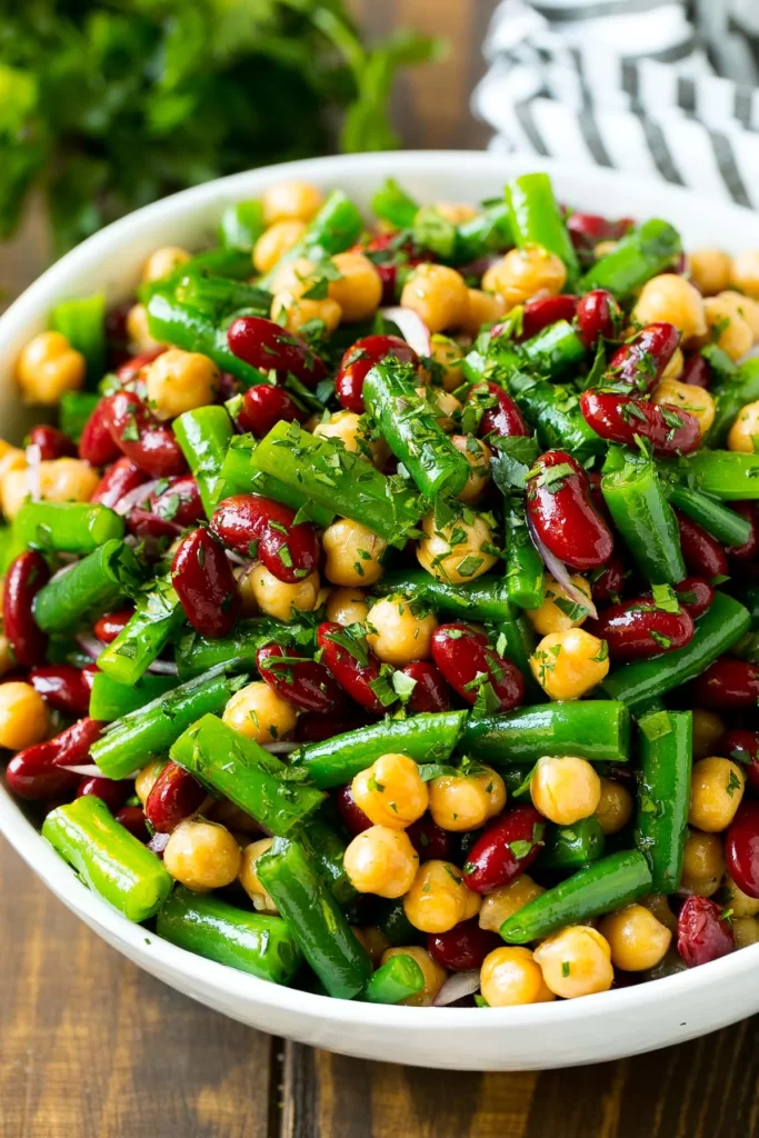 Three Bean Salad - What to Serve with Shredded BBQ Chicken; here are food + drink recipes and ideas to pair with your favourite shredded BBQ chicken!