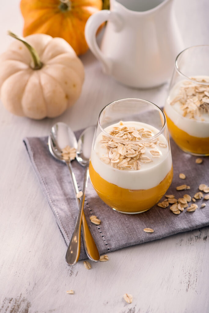 Healthy Coconut Pumpkin Smoothie Recipe; made with pumpkin puree, frozen banana, nut butter, coconut milk and topped with coconut yogurt! A delicious healthy breakfast or snack