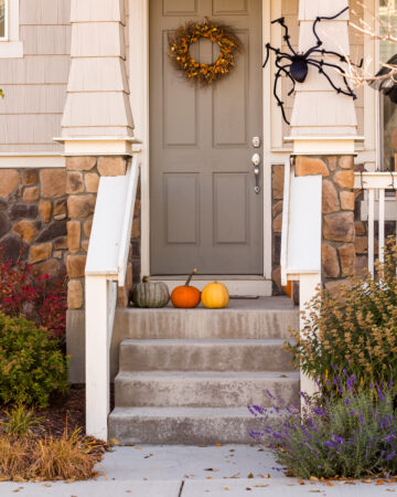 Residential house decorated for Halloween holiday. - Budget Friendly Ways to Decorate Your Home for Fall in 2022; Looking for affordable fall decoration ideas? This list of fall decor ideas is for you!