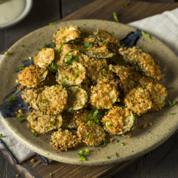 The Best Air Fryer Parmesan Zucchini Chips Recipe; quick 10 minute breaded zucchini chips that are crispy yet healthy! A delicious low/carb and keto-friendly snack or appetizer!