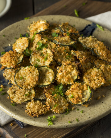 The Best Air Fryer Parmesan Zucchini Chips Recipe; quick 10 minute breaded zucchini chips that are crispy yet healthy! A delicious low/carb and keto-friendly snack or appetizer!