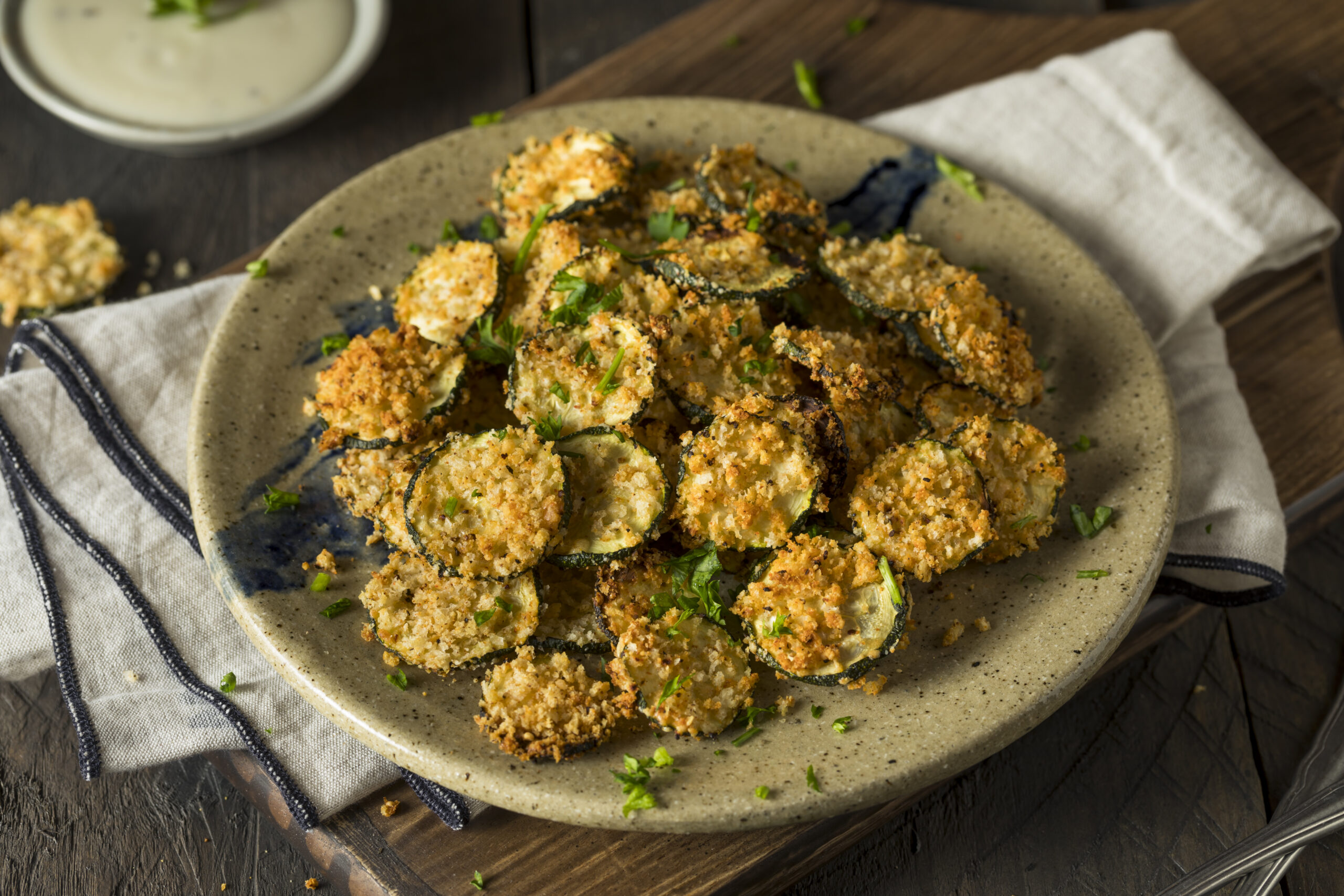 The Best Air Fryer Parmesan Zucchini Chips Recipe; quick 10 minute breaded zucchini chips that are crispy yet healthy! A delicious low/carb and keto-friendly snack or appetizer!