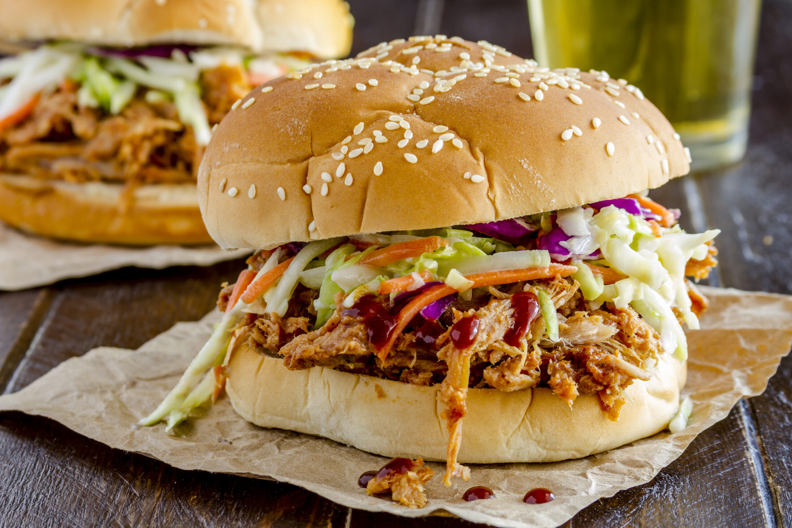 Spicy Pulled Pork Sandwiches Recipe; Homemade BBQ sauce with this pork shoulder for fall off the bone perfection! Great for lunch or dinner.