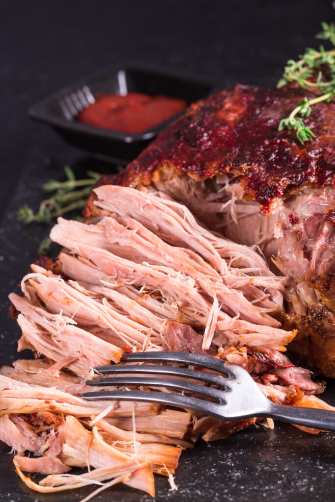 Pulling pork with fork - Spicy Pulled Pork Sandwiches Recipe; Homemade BBQ sauce with this pork shoulder for fall off the bone perfection! Great for lunch or dinner.