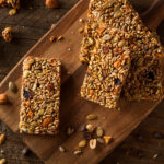 Homemade Granola Bar Recipe with Pumpkin Seeds; This easy raw granola bar recipe is backed with pumpkin seeds, sunflower seeds, rice puffs, and almonds.