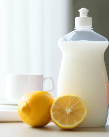 Homemade Lemon Liquid Dish Soap Recipe; easy homemade dish soap recipe with lemon essential oil, vinegar and sal suds!