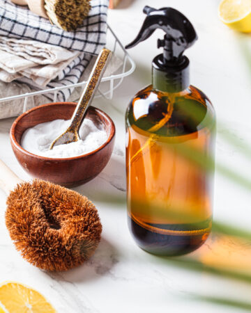 Natural Window and Glass Cleaner Recipe; easy homemade window and glass cleaning solution made with rubbing alcohol, vinegar, essential oils and cornstarch.