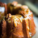 Pumpkin Apple Bundt Cake Recipe With Caramel Glaze; This delicious autumn bundt cake dessert is loaded with pumpkin spice, apples, pecans and drizzled with caramel glaze.