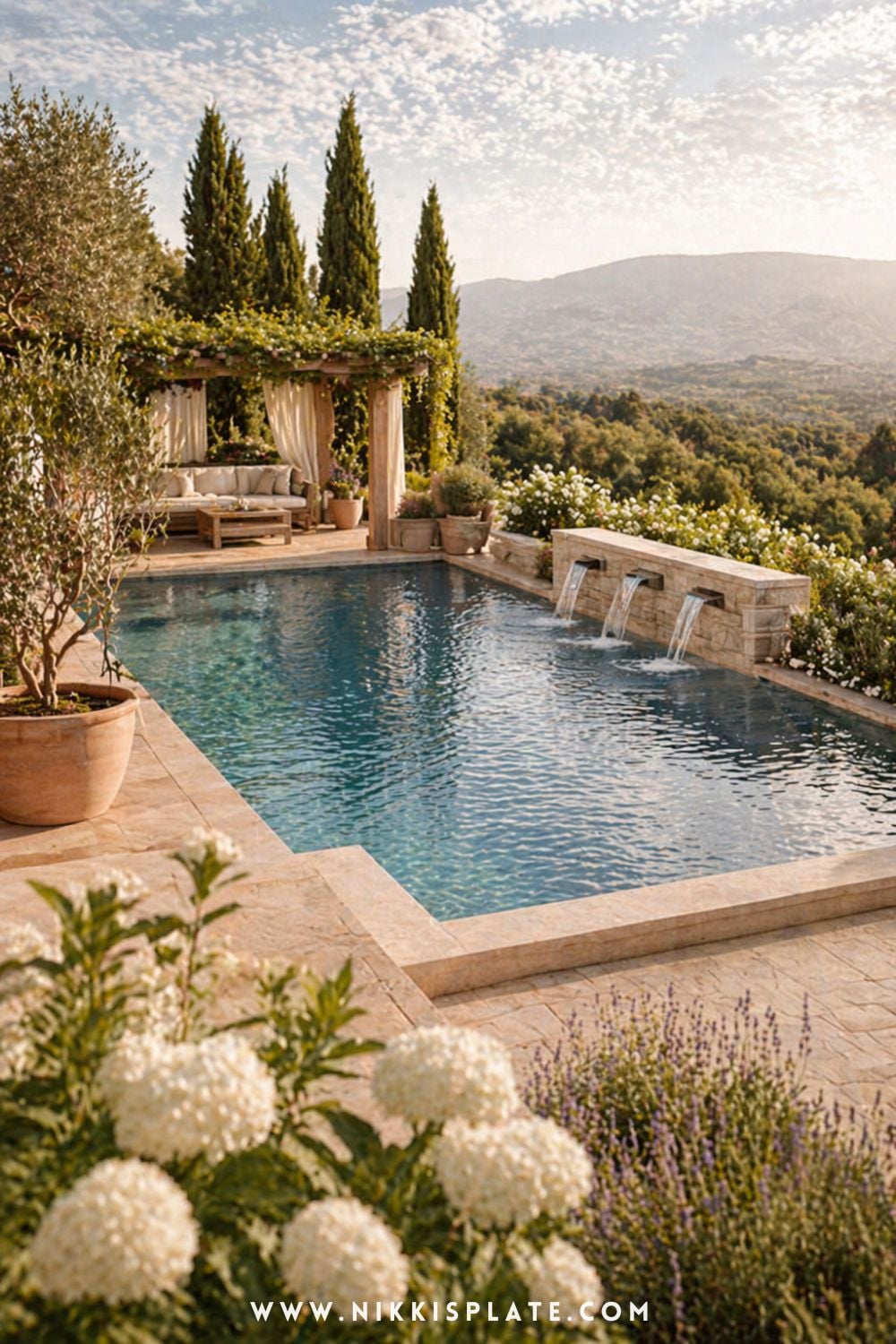 Hillside infinity pool with stone patio, pergola seating area, and scenic landscape views in a cozy outdoor living space
