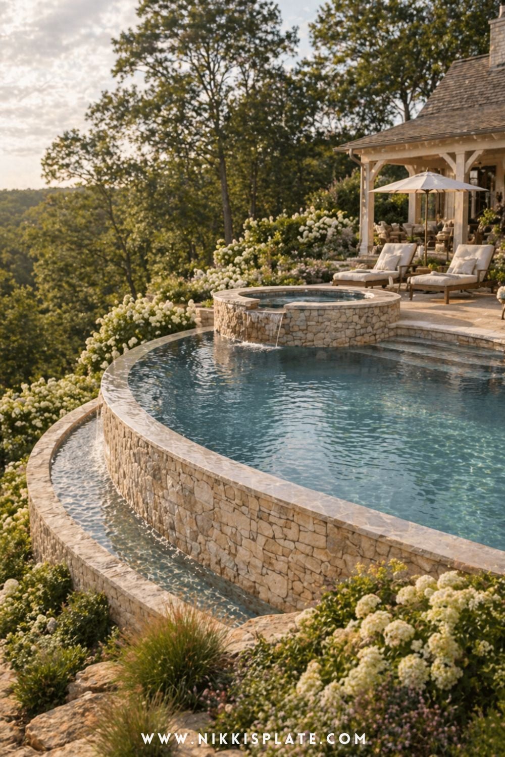 This breathtaking hillside pool design features soft, curved retaining walls and an infinity-style edge that flows beautifully into the surrounding landscape. It's a stunning take on hillside pool ideas with retaining walls, especially if you're dreaming of a peaceful, resort-style escape right at home. If you're looking for luxury backyard ideas for a sloped yard with a pool, this is definitely one to save-it shows how thoughtful outdoor living design can create a truly relaxing and elevated space.