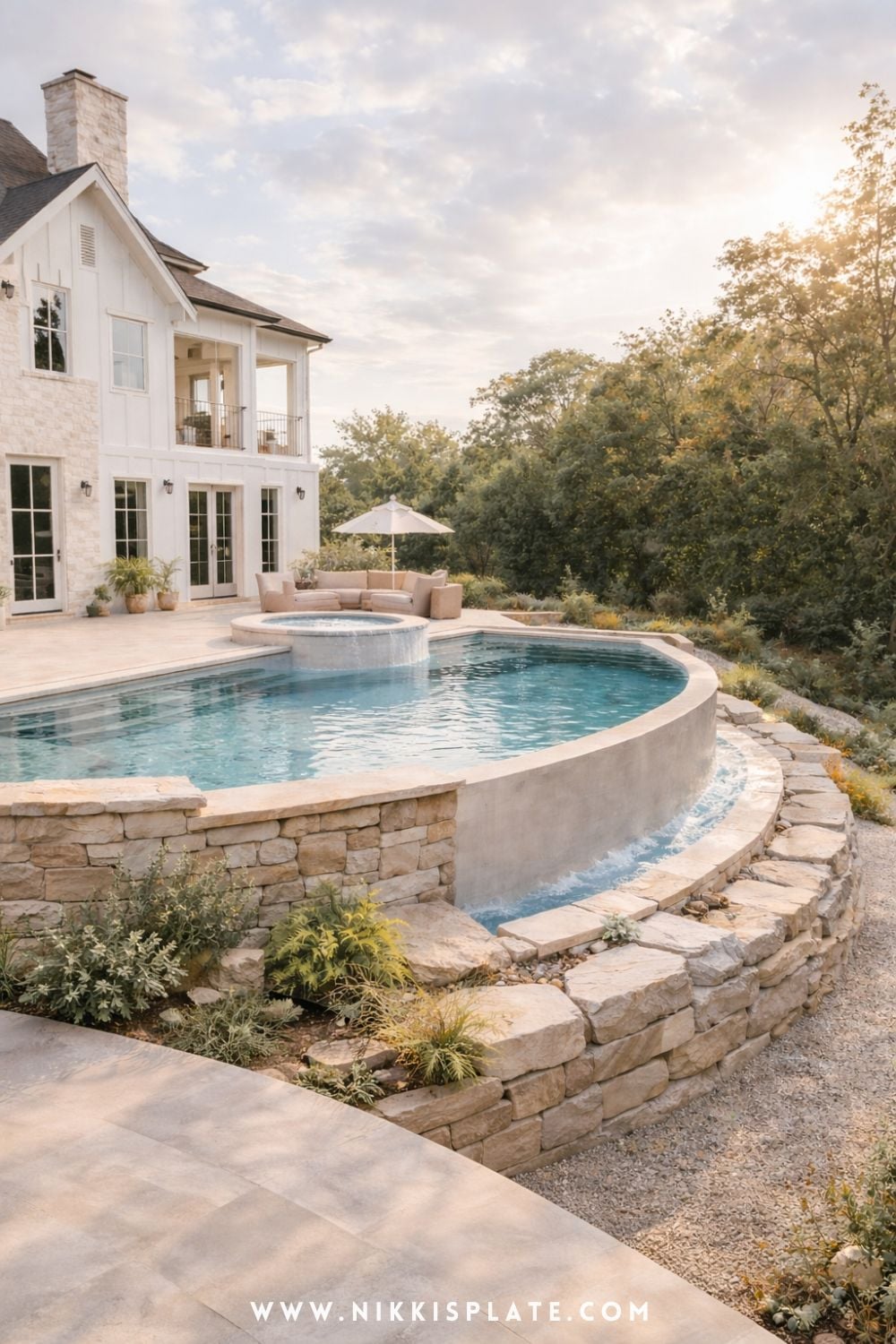 Modern hillside pool with retaining walls and curved design for a sloped backyard with natural stone landscaping
