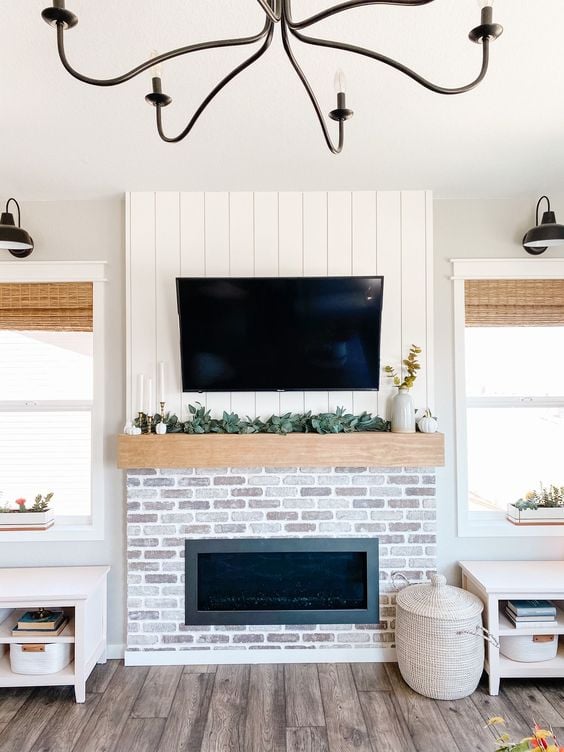 shiplap fireplace with brick and mantel || 20 Vertical Shiplap Wall Ideas {Vertical Shiplap Wall Ideas, shiplap accent wall ideas, vertical shiplap walls, shiplap accent walls, shiplap wall ideas}