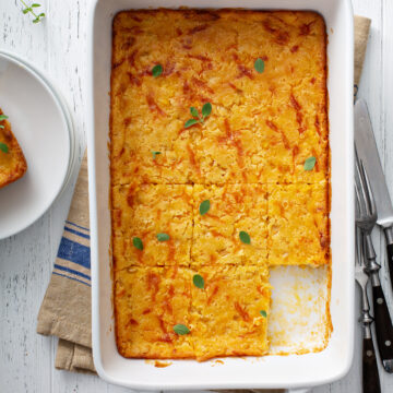 Easy Cheesy Cornbread Casserole Recipe; a delicious comforting side dish for thanksgiving, Christmas or any holiday! Made with cornmeal and cheddar cheese!