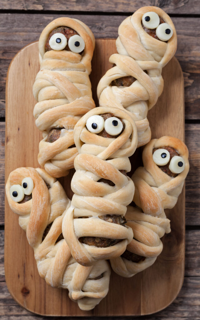 Easy Halloween Hot Dog Mummy Recipe; two ingredient mummy dogs using crescent dough and hot dogs. Easy fun Halloween recipe for kids!