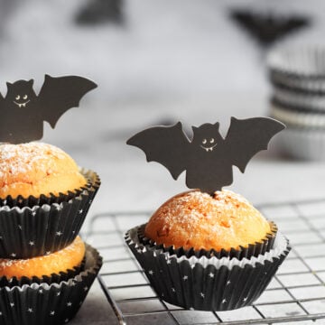 Halloween Bat Pumpkin Muffins; a cute festive halloween muffin recipe with cardboard bat top. Spooky halloween muffins!