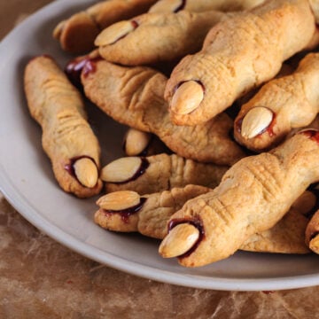 Easy Halloween Witch Finger Cookies (Using Store Bought Dough) - this is the easiest way to make this spooky witch finger cookie recipe for Halloween fun! Great for kids and for parties.