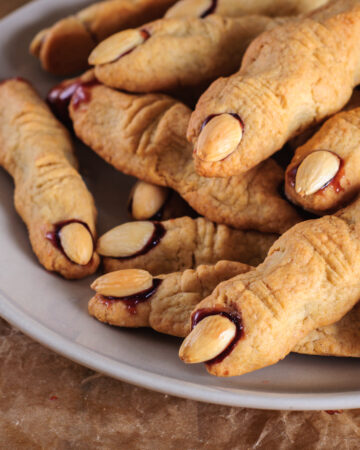 Easy Halloween Witch Finger Cookies (Using Store Bought Dough) - this is the easiest way to make this spooky witch finger cookie recipe for Halloween fun! Great for kids and for parties.
